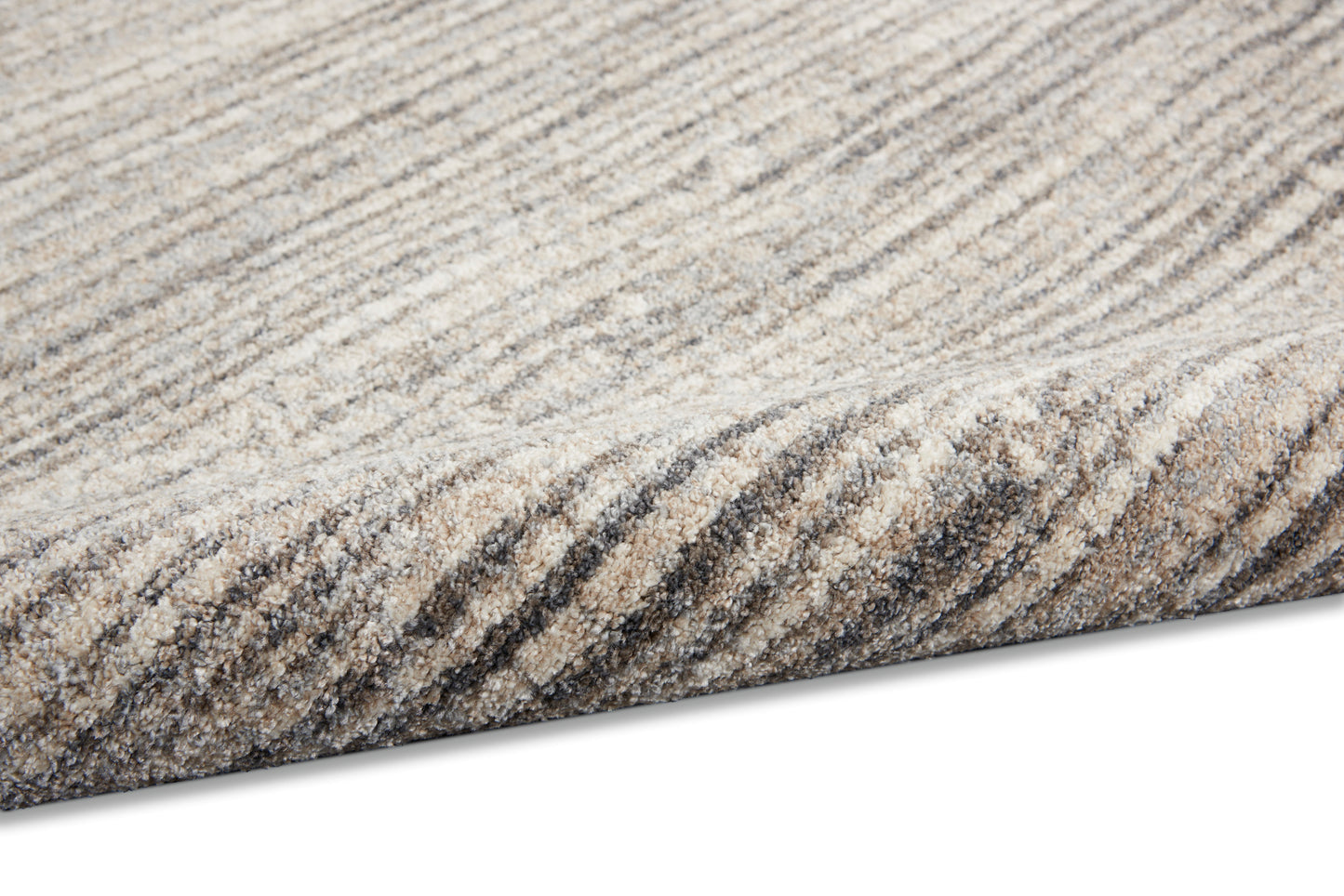 Neutral striped area rug in beige, taupe and gray; textured soft pile with a rolled edge.