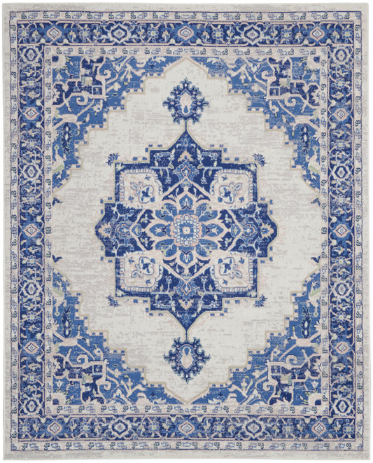 Blue and ivory oriental rug with central medallion, ornate border and geometric motifs; rectangular area rug.