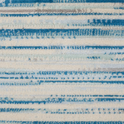 Blue and white striped woven textile with a soft, textured pile; versatile rug or throw.