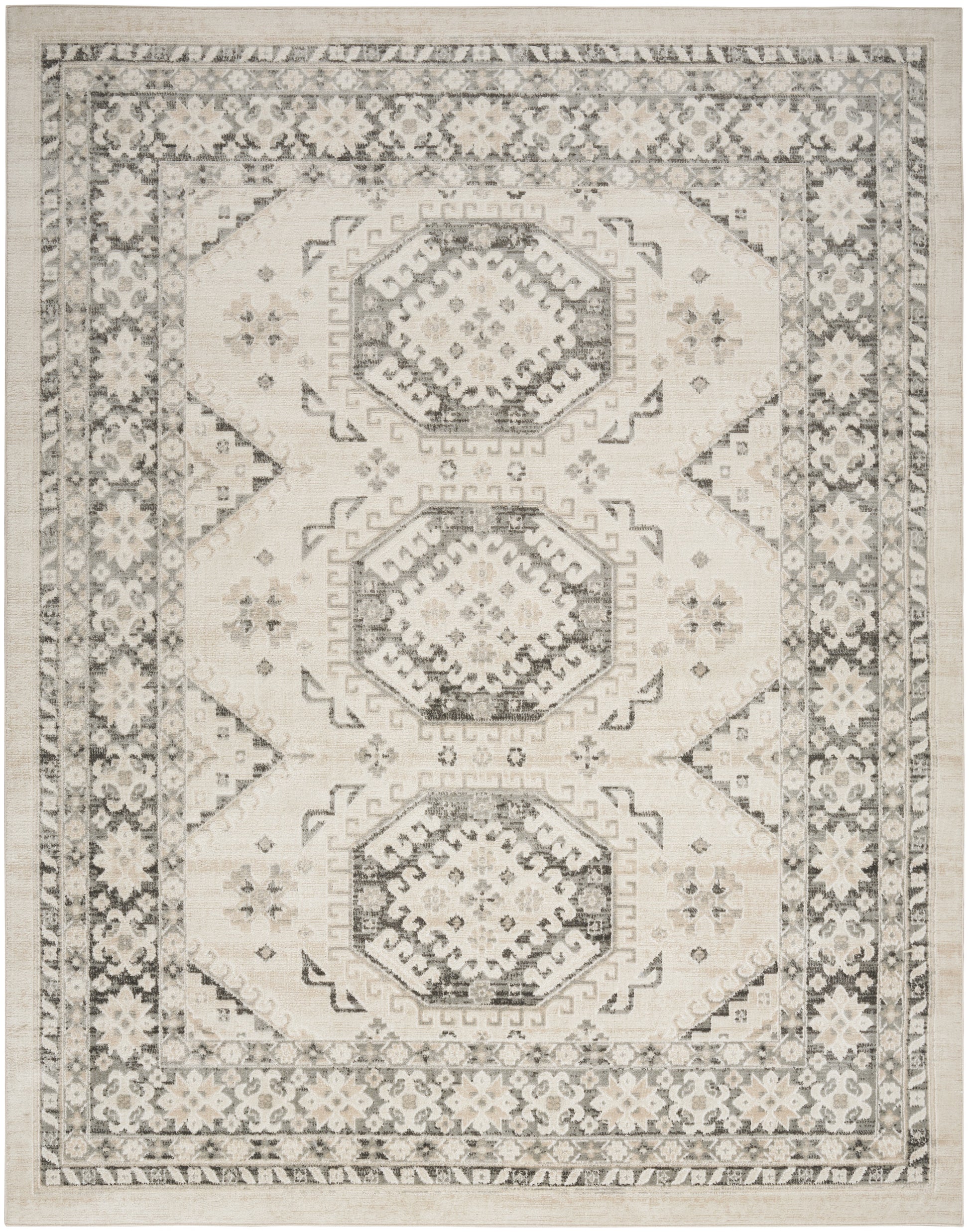 Beige geometric area rug with three gray octagonal medallions, intricate border floral motifs, vintage distressed look.