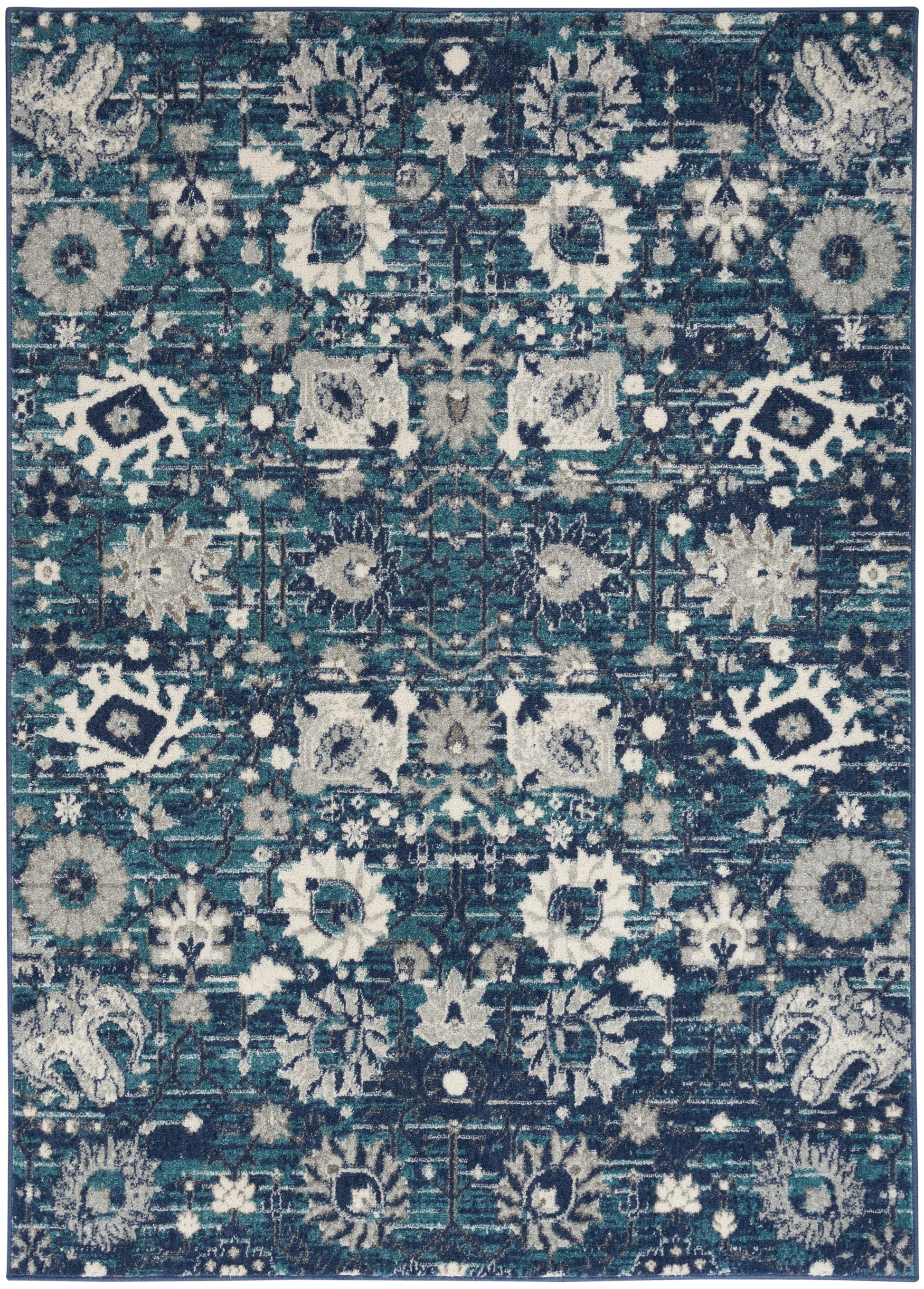 Rectangular area rug in teal, navy & cream with distressed oriental floral motif and medallion pattern.