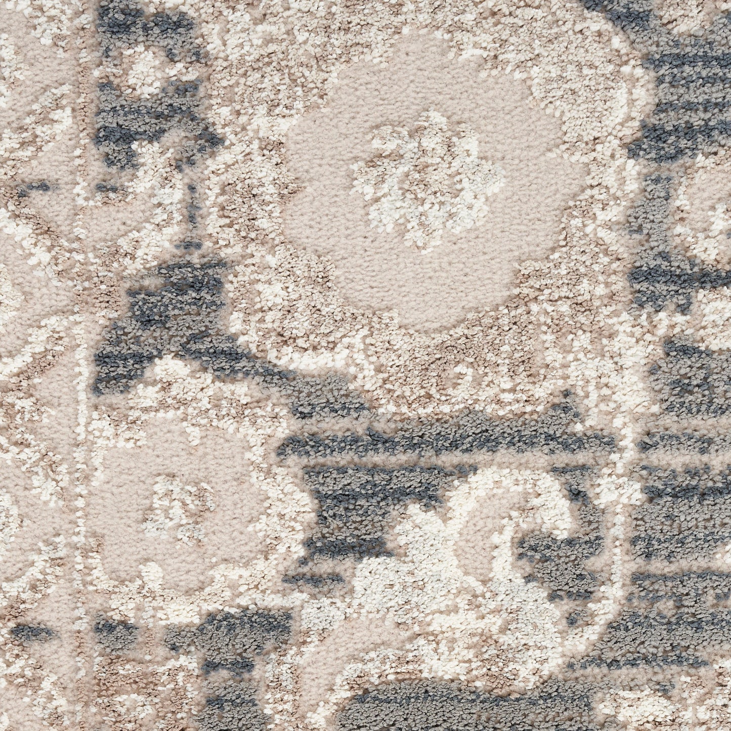 Beige and blue oriental rug with floral medallions; plush tufted texture for living room decor.