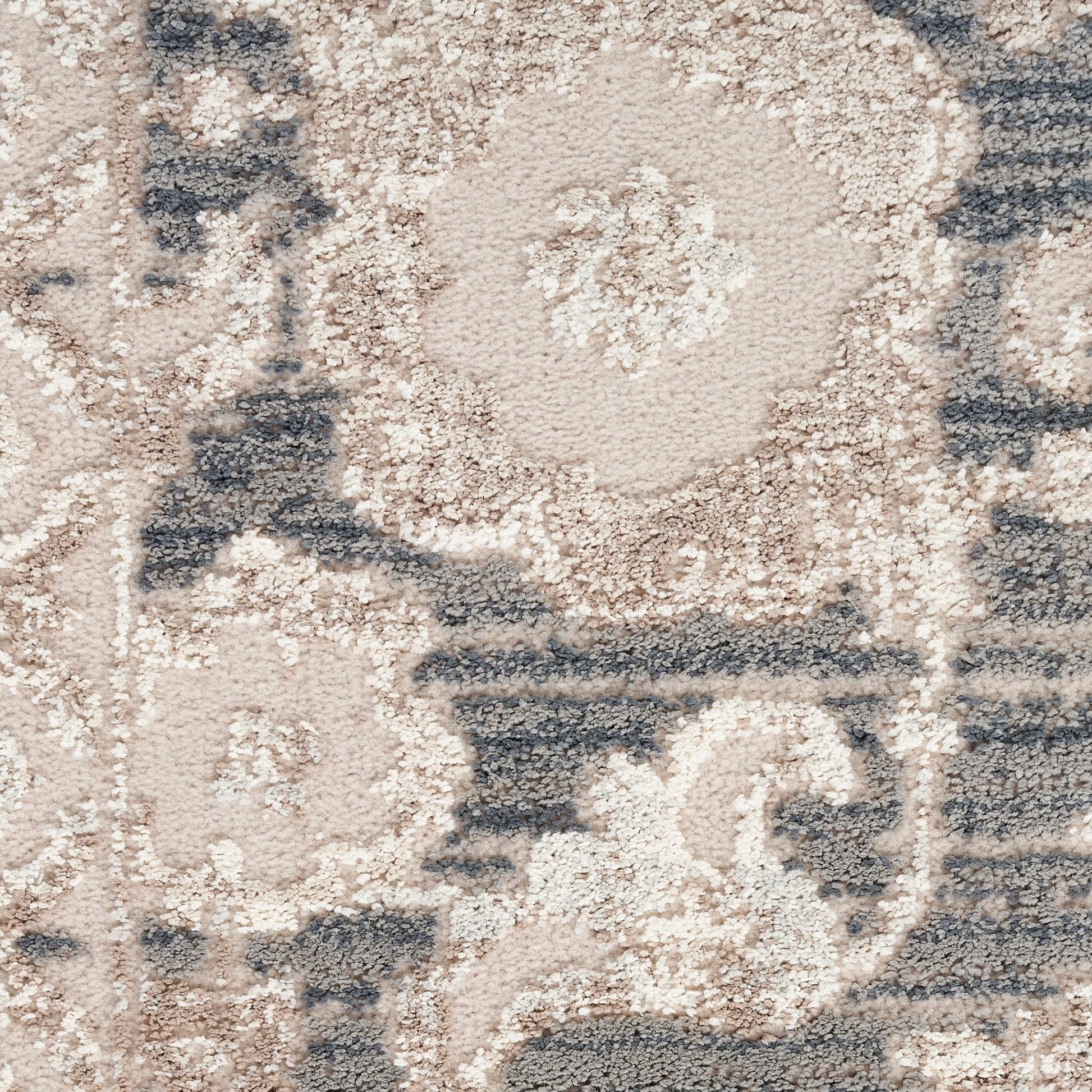 Beige and blue oriental rug with floral medallions; plush tufted texture for living room decor.