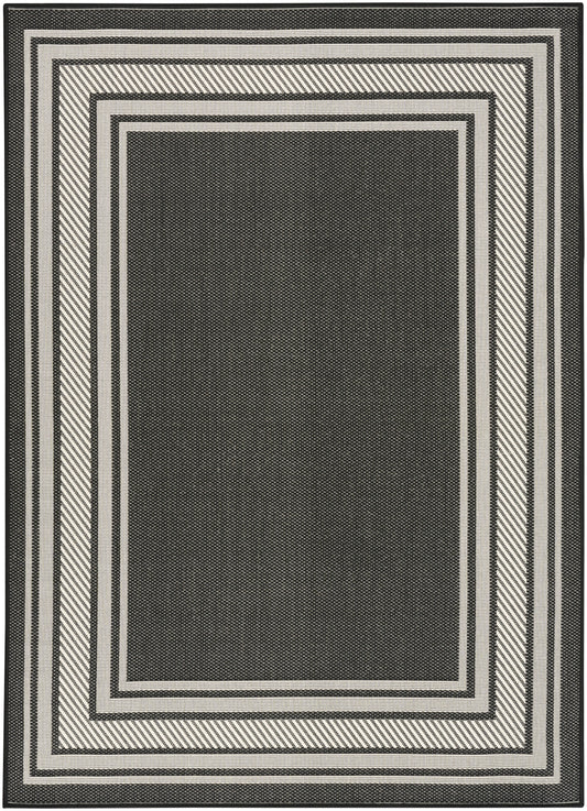 Black rectangular area rug with cream & gray concentric border frames in a geometric woven pattern.
