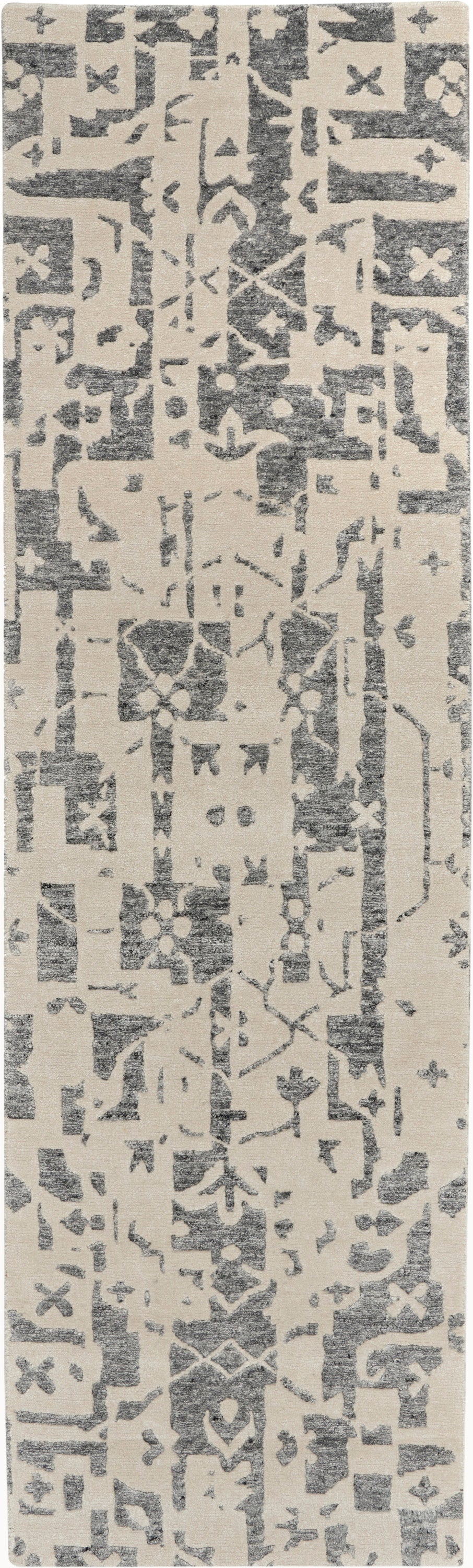 Long beige runner rug with dark gray distressed geometric motifs; Moroccan-inspired pattern.