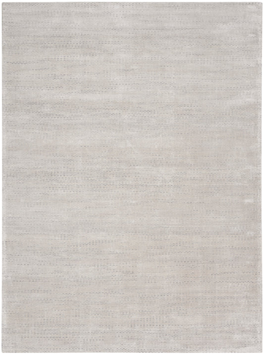 Light beige area rug with subtle woven texture; rectangular, neutral flat-weave style for living room or bedroom.