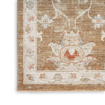 Corner of a brown-beige oriental rug with ivory border and floral medallion in peach, blue and ivory.