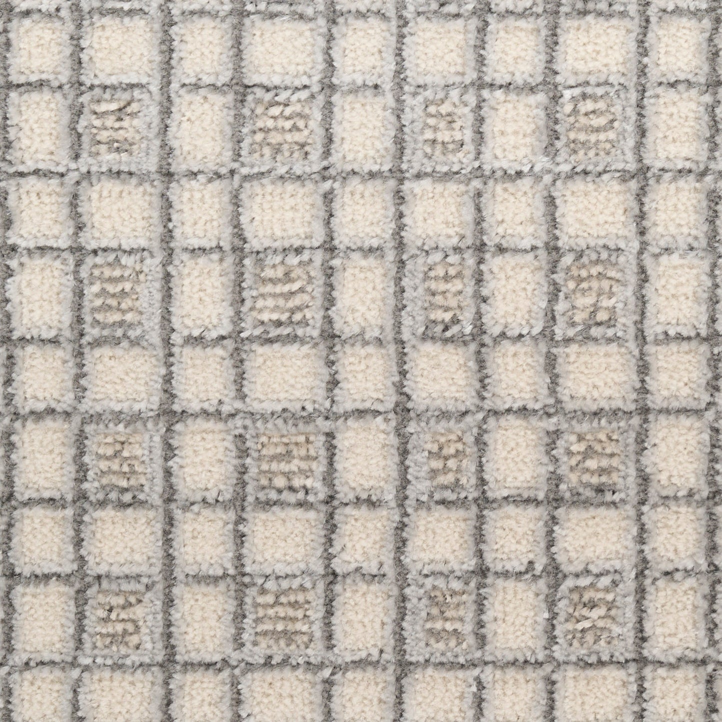 Cream and gray checkered shag rug with square grid pattern and soft loop-pile texture.