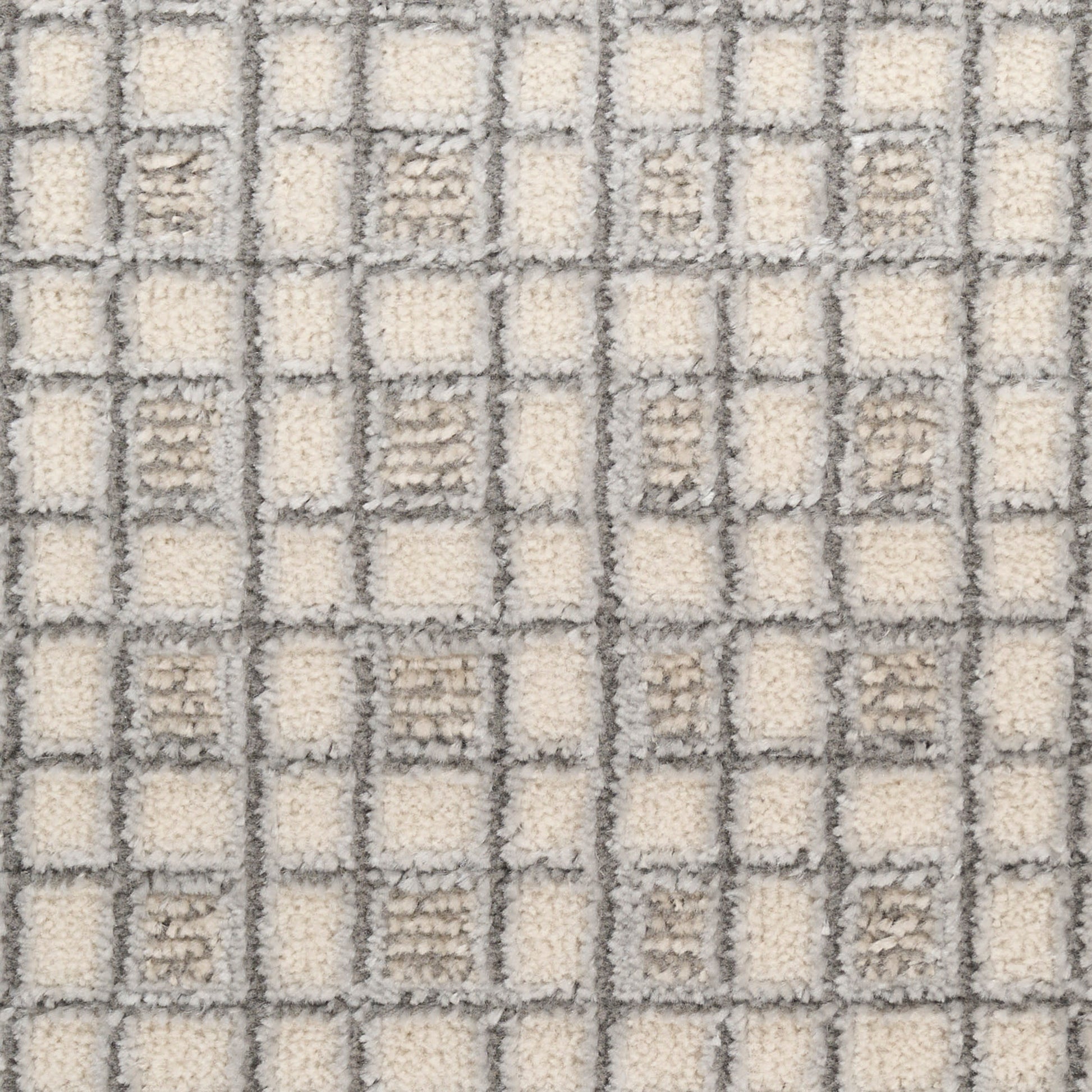 Cream and gray checkered shag rug with square grid pattern and soft loop-pile texture.