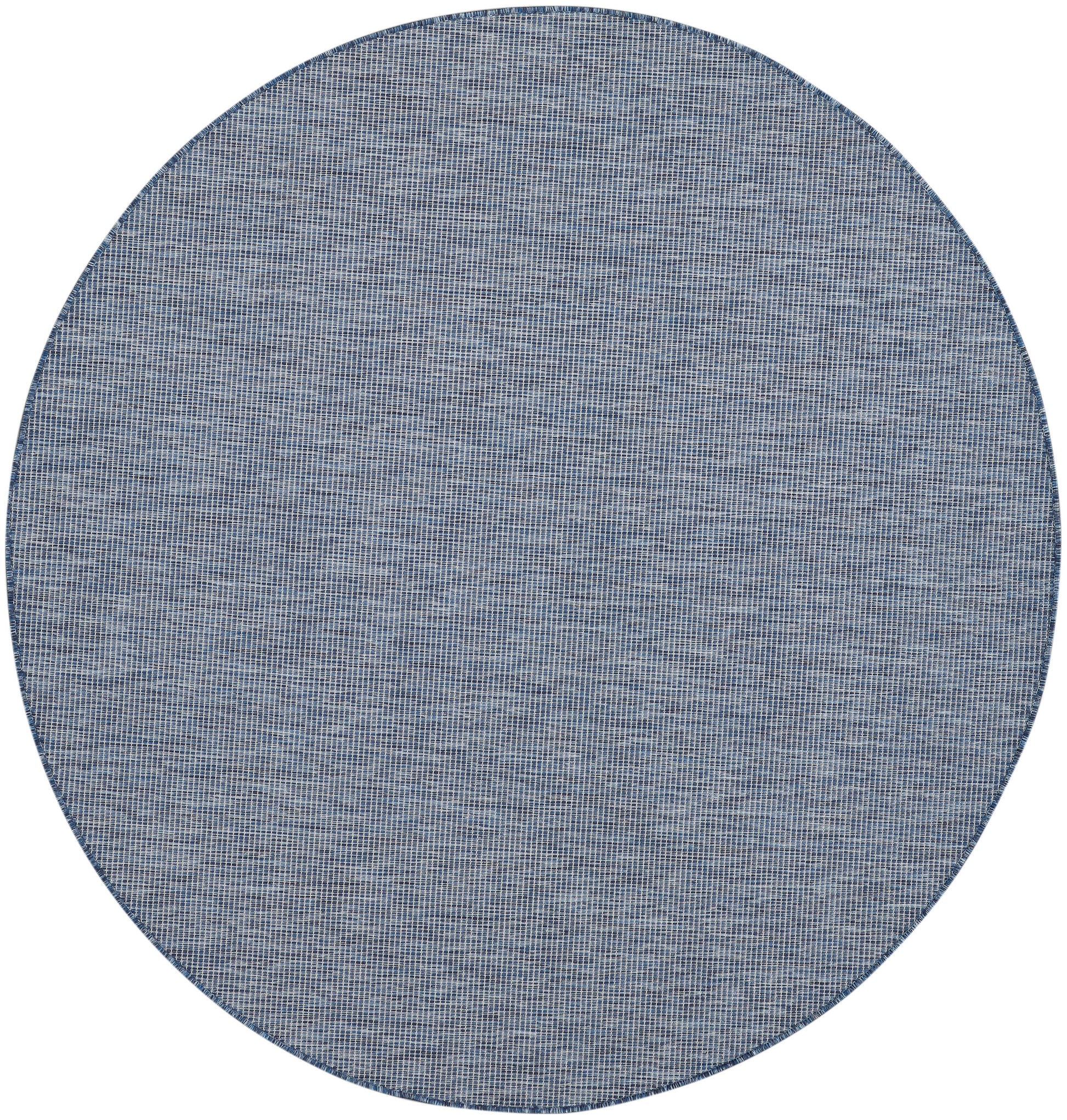 Round denim-blue woven rug with subtle grid texture and dark edge.