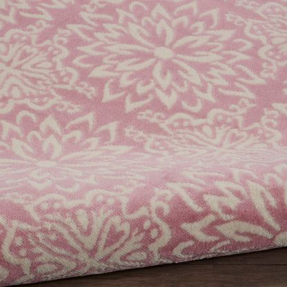 Soft pink round rug with a white mandala floral pattern, farmhouse style, 5 ft diameter.