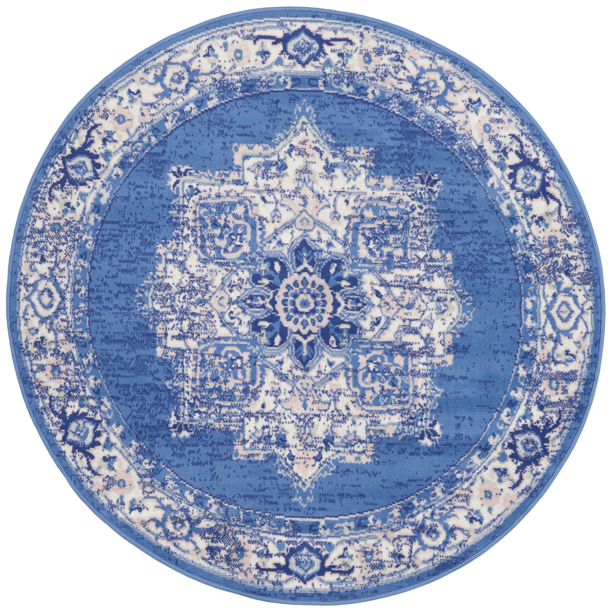 Round blue and white rug with an intricate central medallion and ornate border.