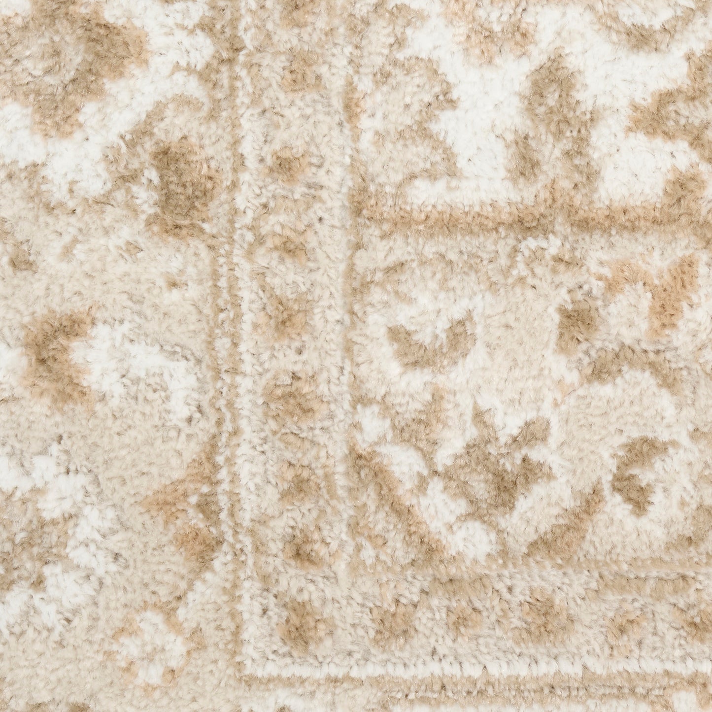 Plush beige and ivory oriental-style area rug with floral motifs and bordered edge.