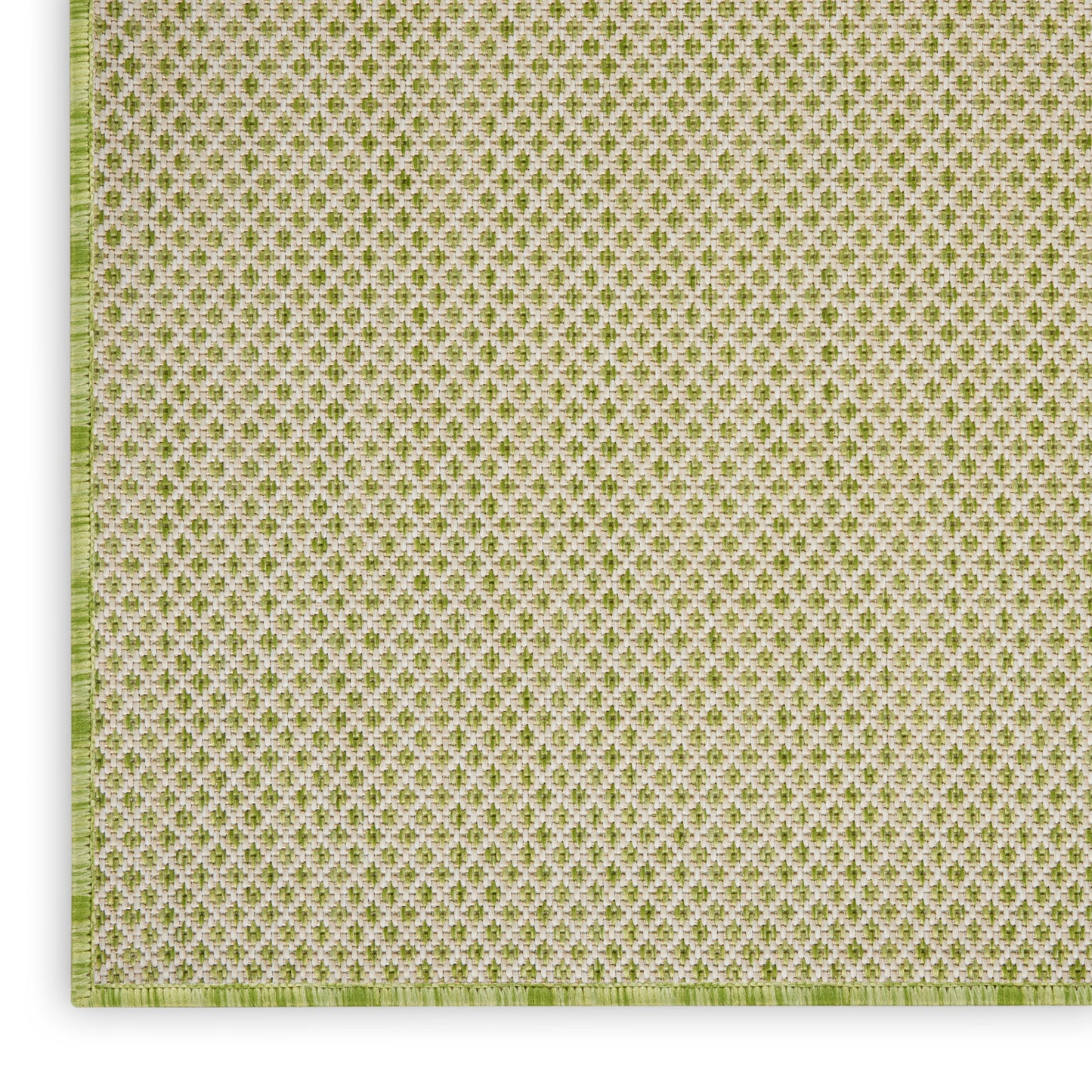 Green and white woven textile with tiny repeating quatrefoil motif; square placemat with pale green border.