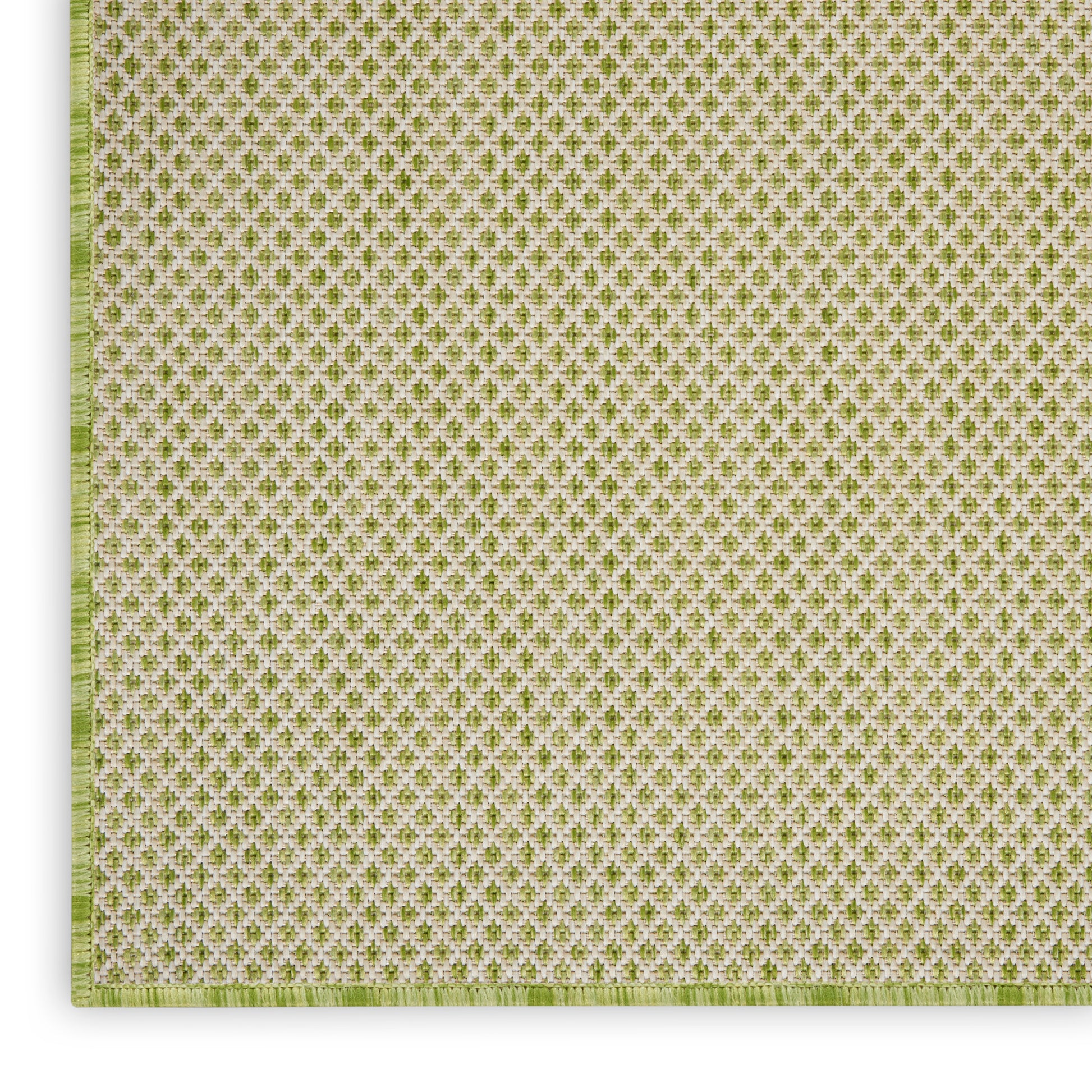 Green and white woven textile with tiny repeating quatrefoil motif; square placemat with pale green border.