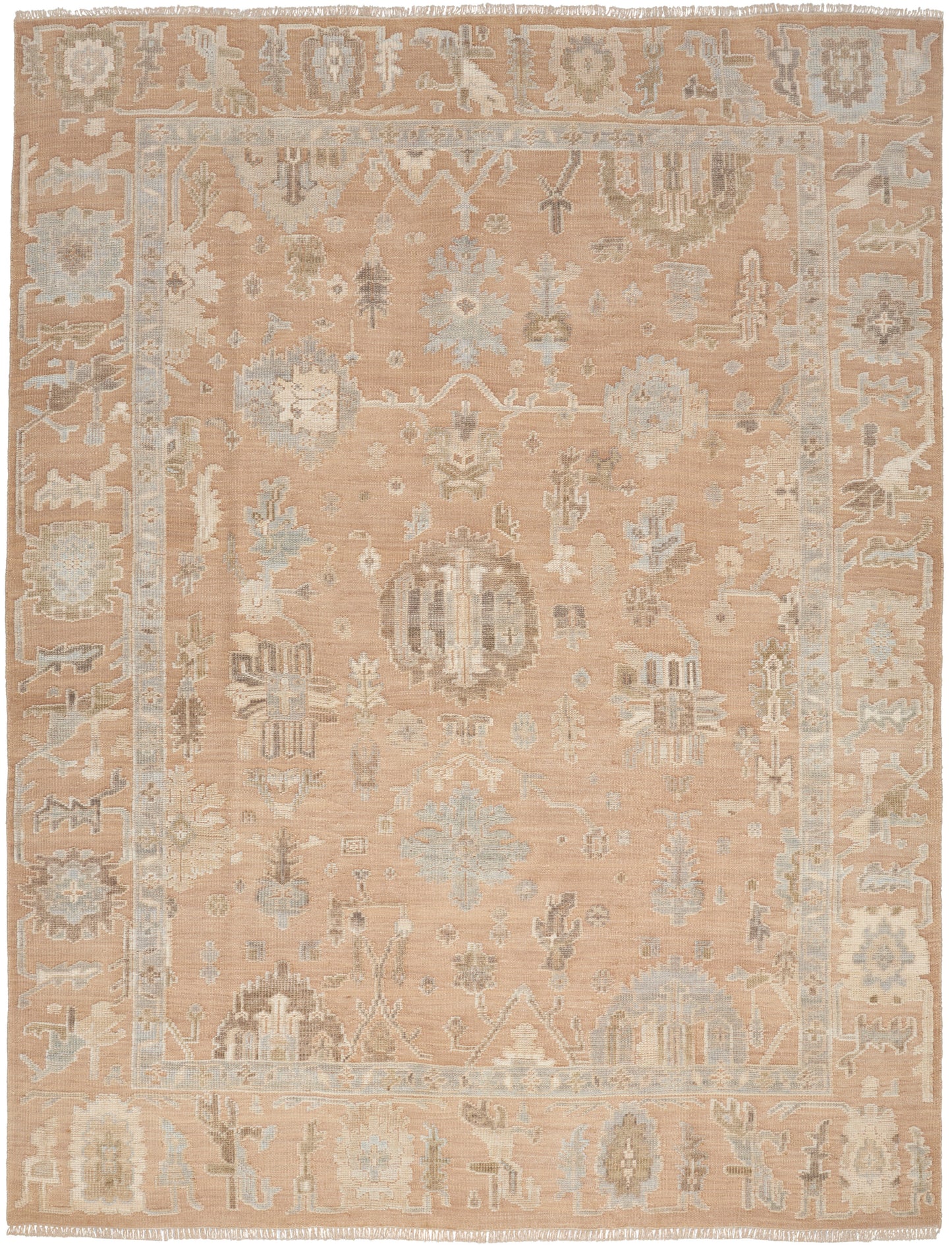 Soft peach rug with muted blue and ivory floral motifs, decorative border and fringed ends.
