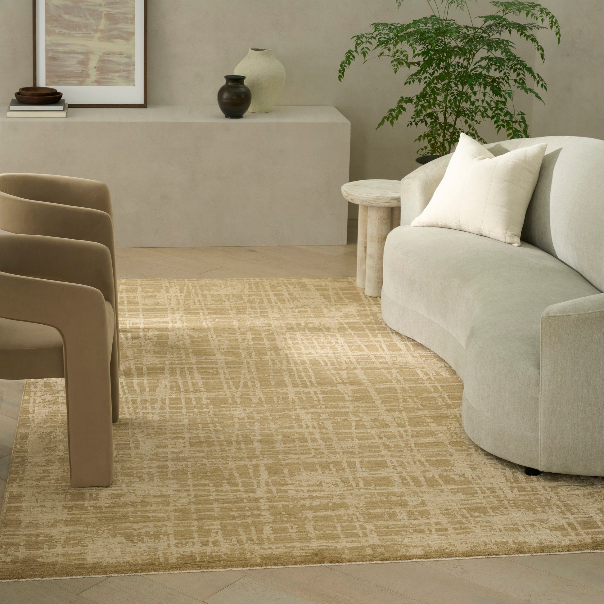 Beige modern area rug with a textured weave in a neutral living room, 5' x 8'.