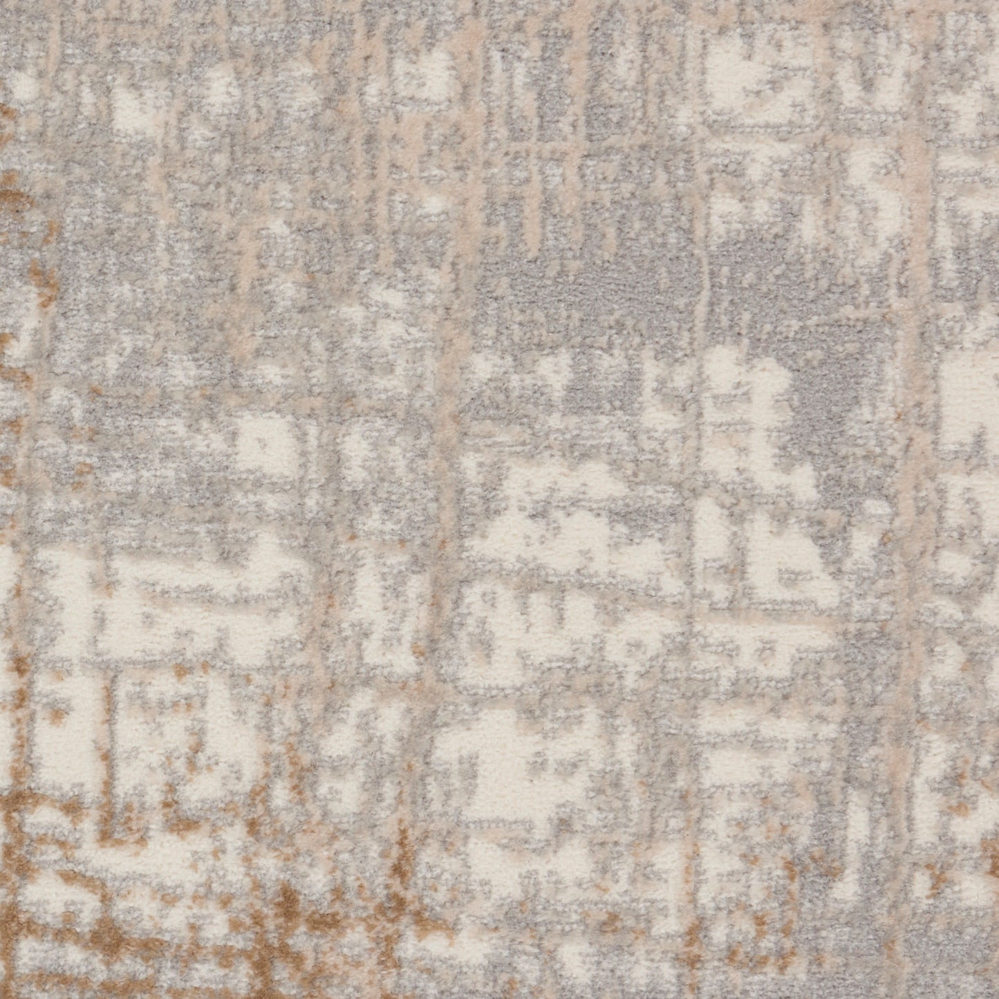 Rectangular soft textured area rug with a distressed geometric pattern in ivory, taupe & gray.