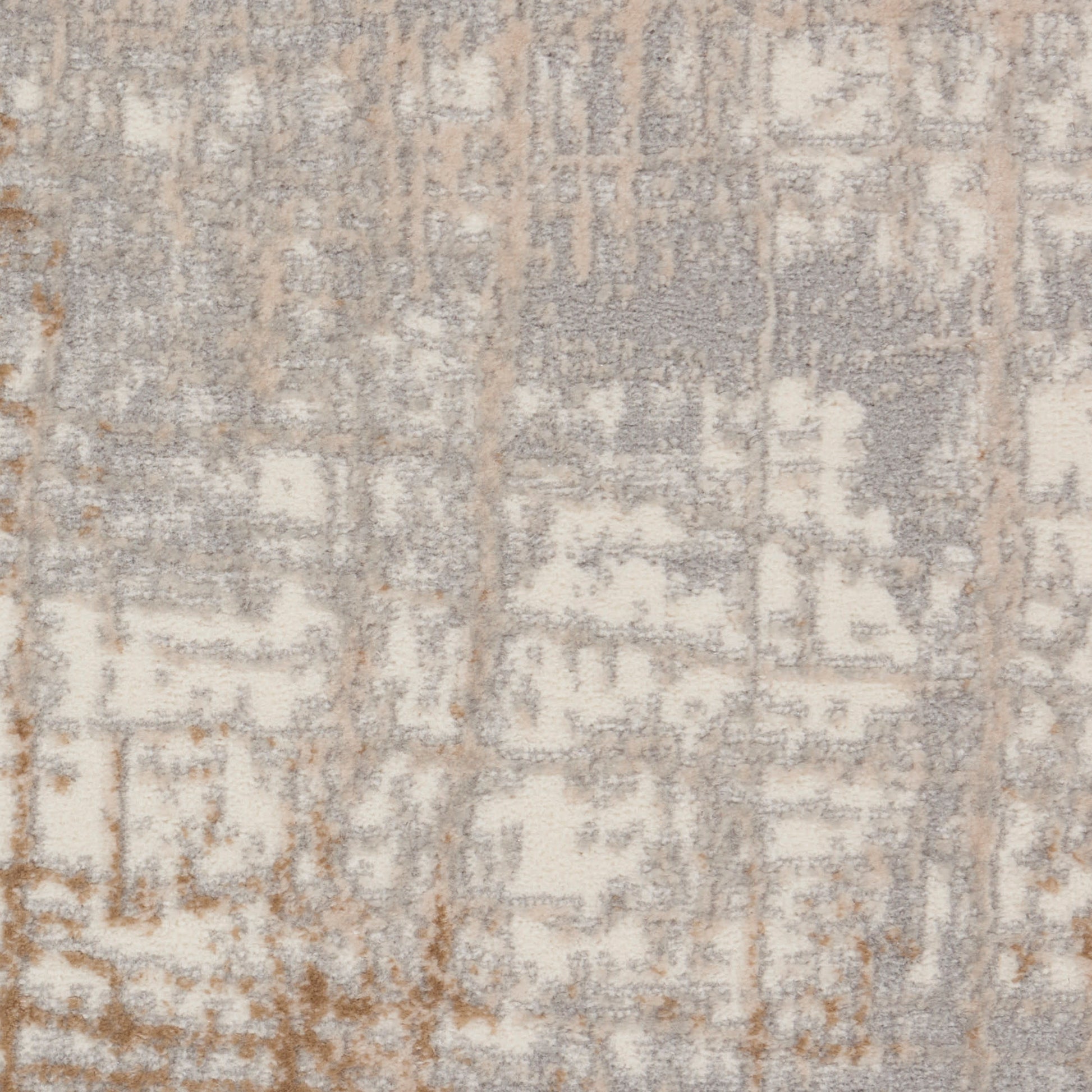 Rectangular soft textured area rug with a distressed geometric pattern in ivory, taupe & gray.