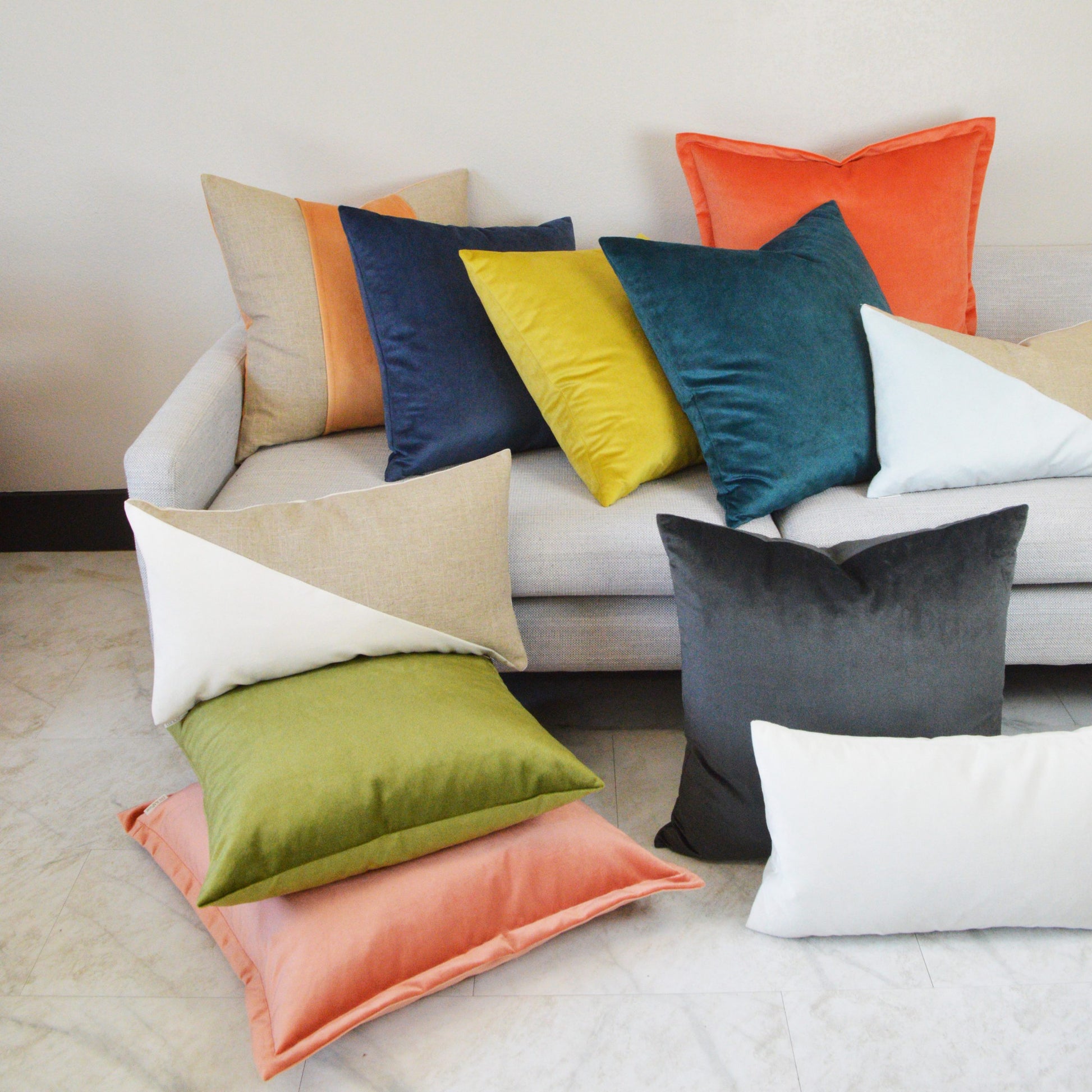 Aloe solid velvet square throw pillow on a light sofa.