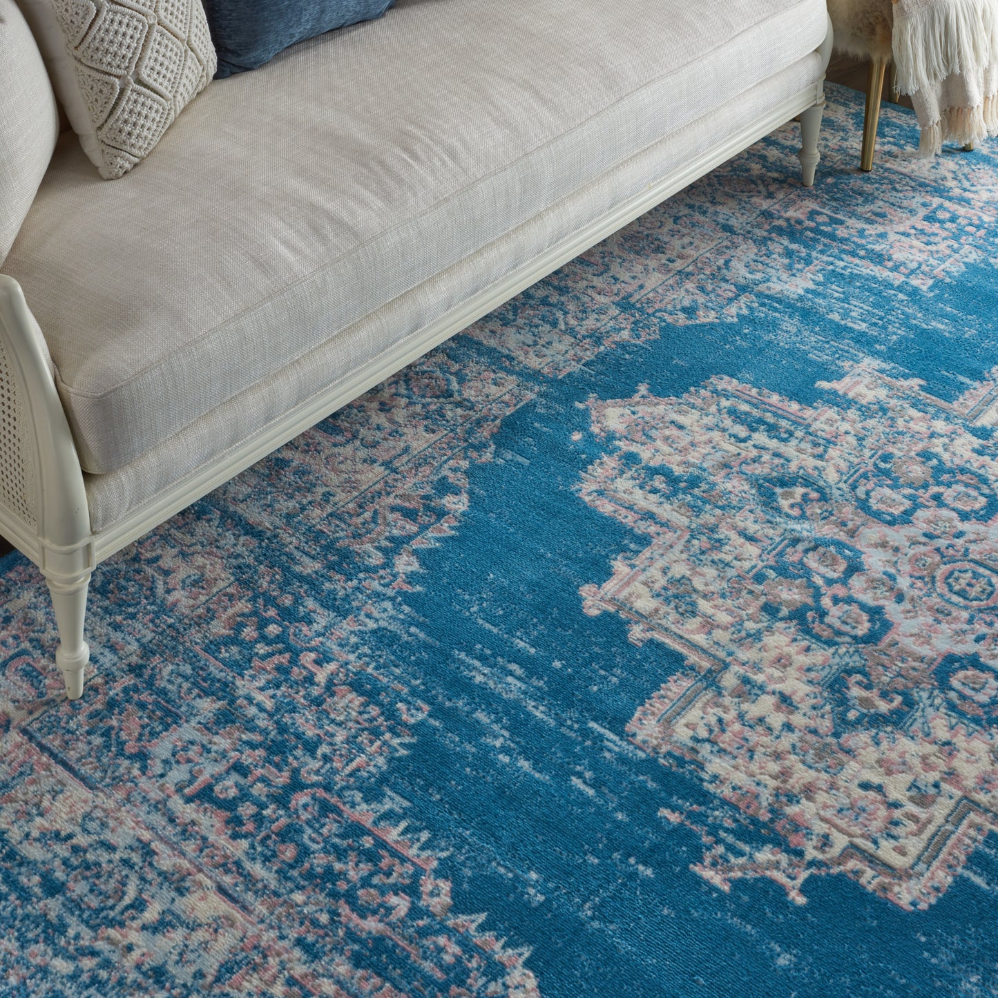 Cream and blue distressed oriental rug, 8' x 10'.