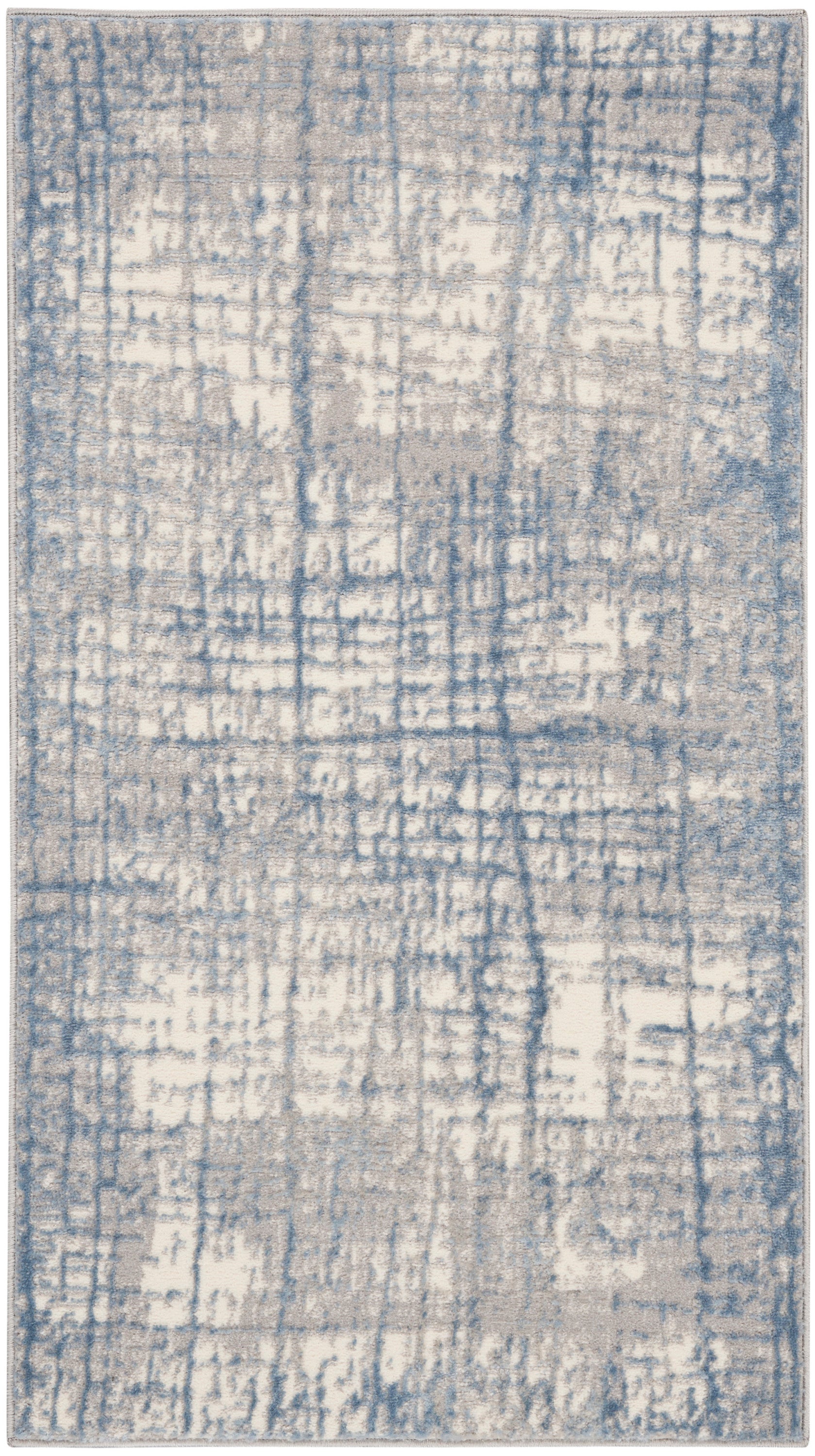 Blue and cream distressed abstract area rug with gray undertones; rectangular, modern pattern.