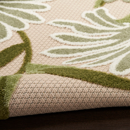 Outdoor beige textured rug, 5' x 8', with olive green leaf motif; looped weave base & raised pile.