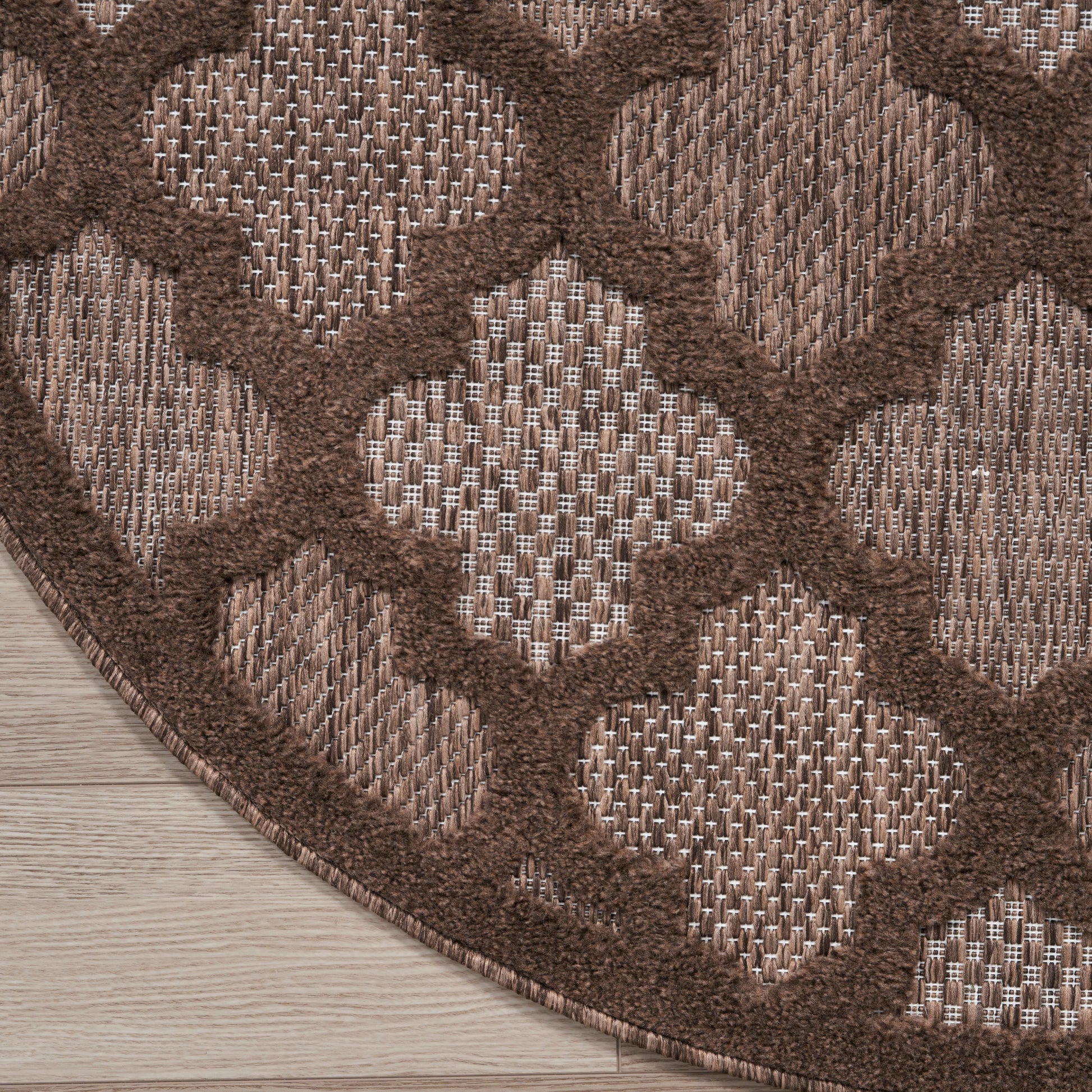 Brown gradient square panel overlaying an outdoor scene with wooden deck and brick wall.