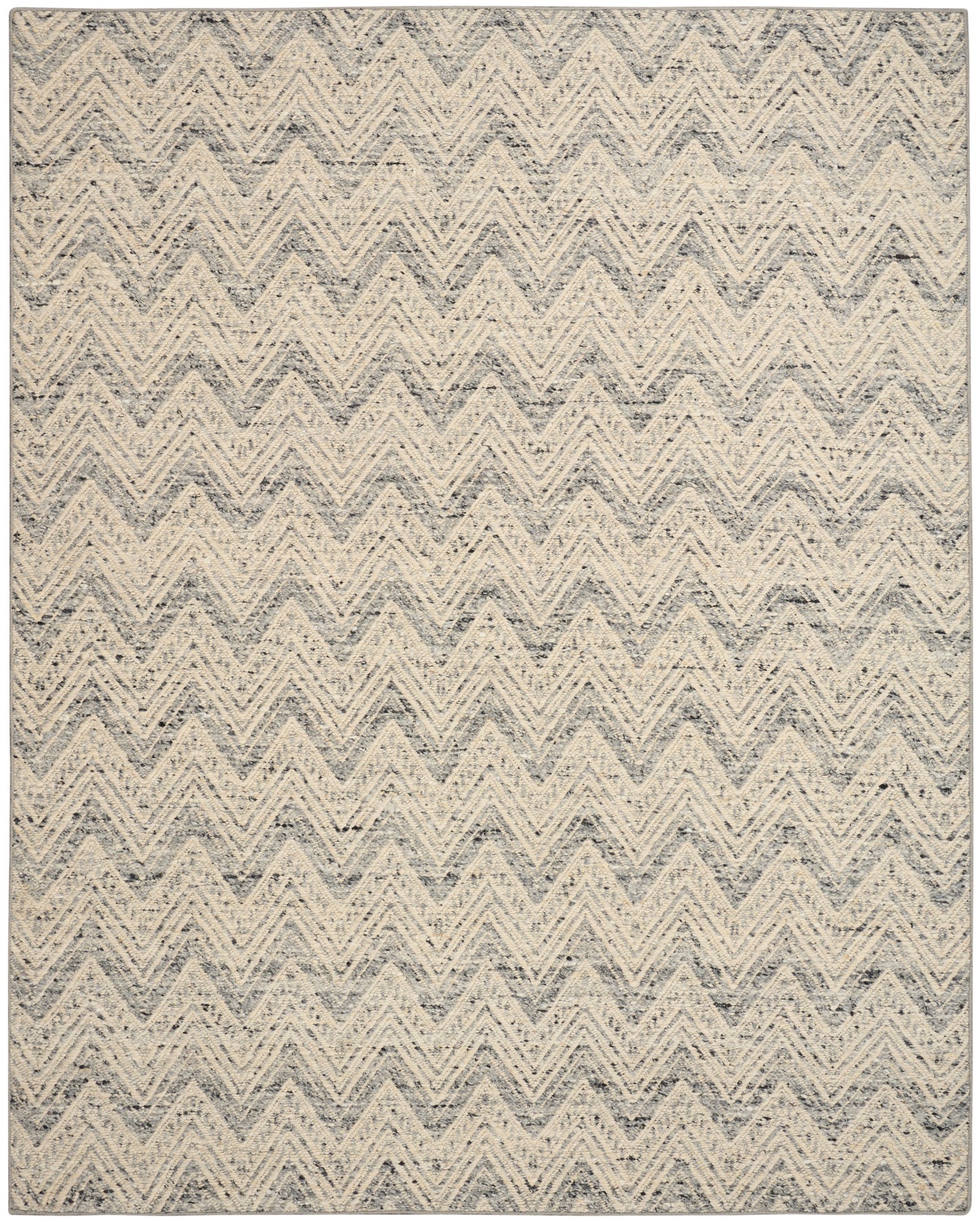Gray and cream chevron rug with speckled textured weave; rectangular modern coastal area rug.