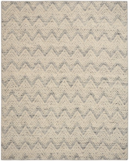 Gray and cream chevron rug with speckled textured weave; rectangular modern coastal area rug.