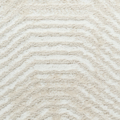 Cream beige shag rug with raised chevron pattern & plush tufted pile for cozy indoor decor.