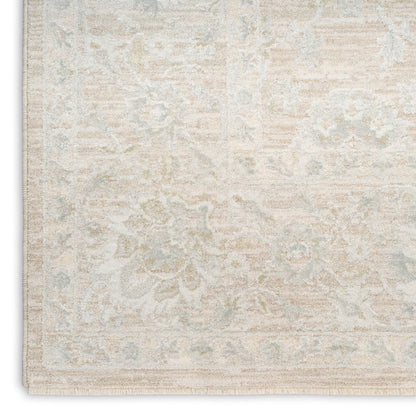 Ivory/beige distressed-pattern area rug with pale blue floral motifs and a bordered edge, traditional oriental style.