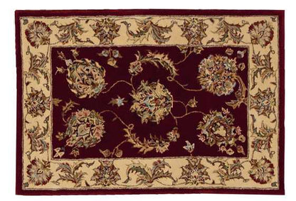 Rectangular rug: deep burgundy center with cream ornate border and floral vine motifs; traditional oriental-style.