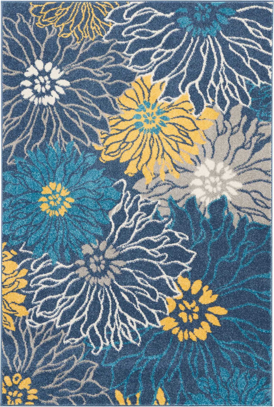 Blue high-pile area rug with bold teal, yellow, white and gray floral daisies; modern decorative pattern.