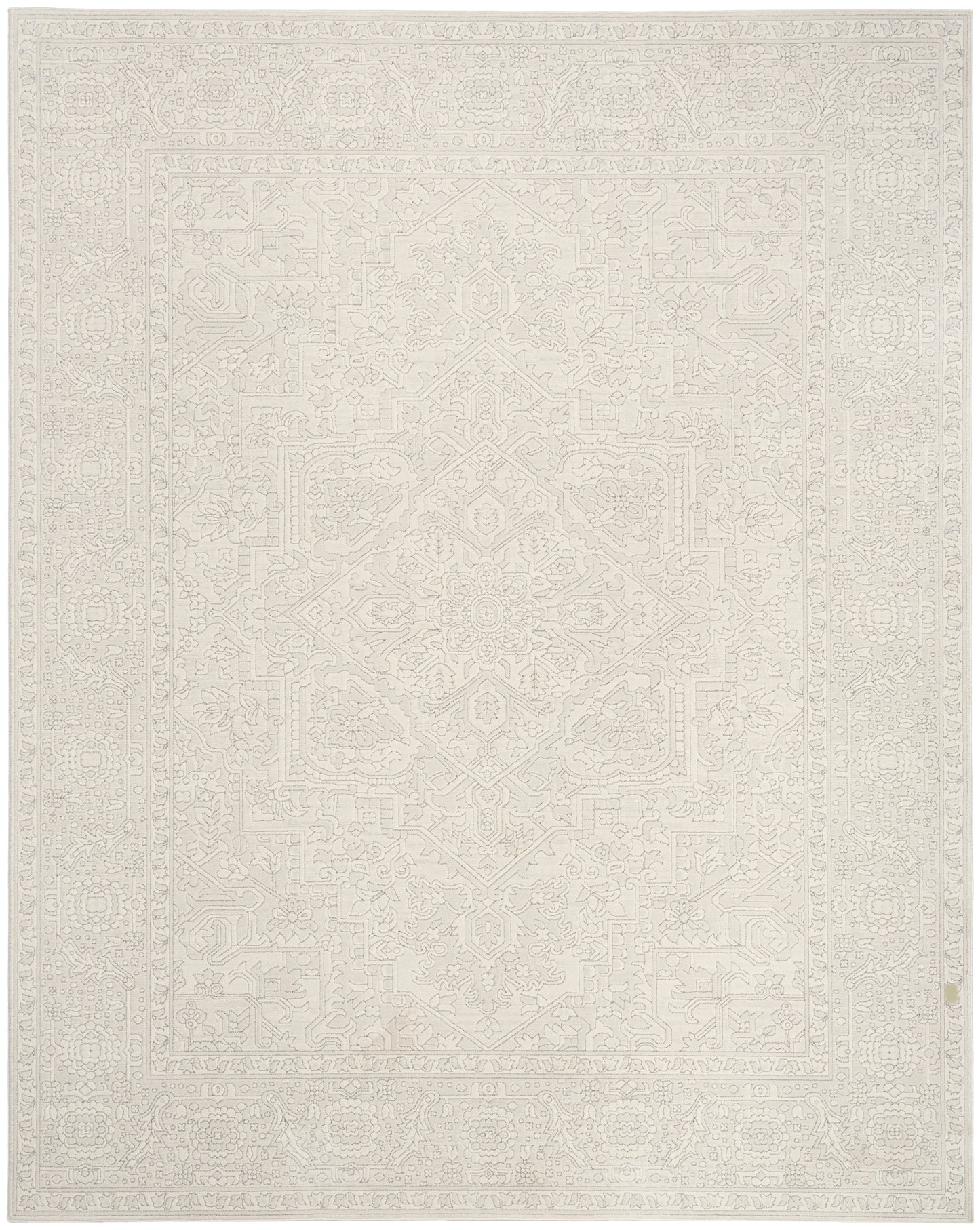Cream-beige area rug with a subtle geometric medallion pattern and delicate border.
