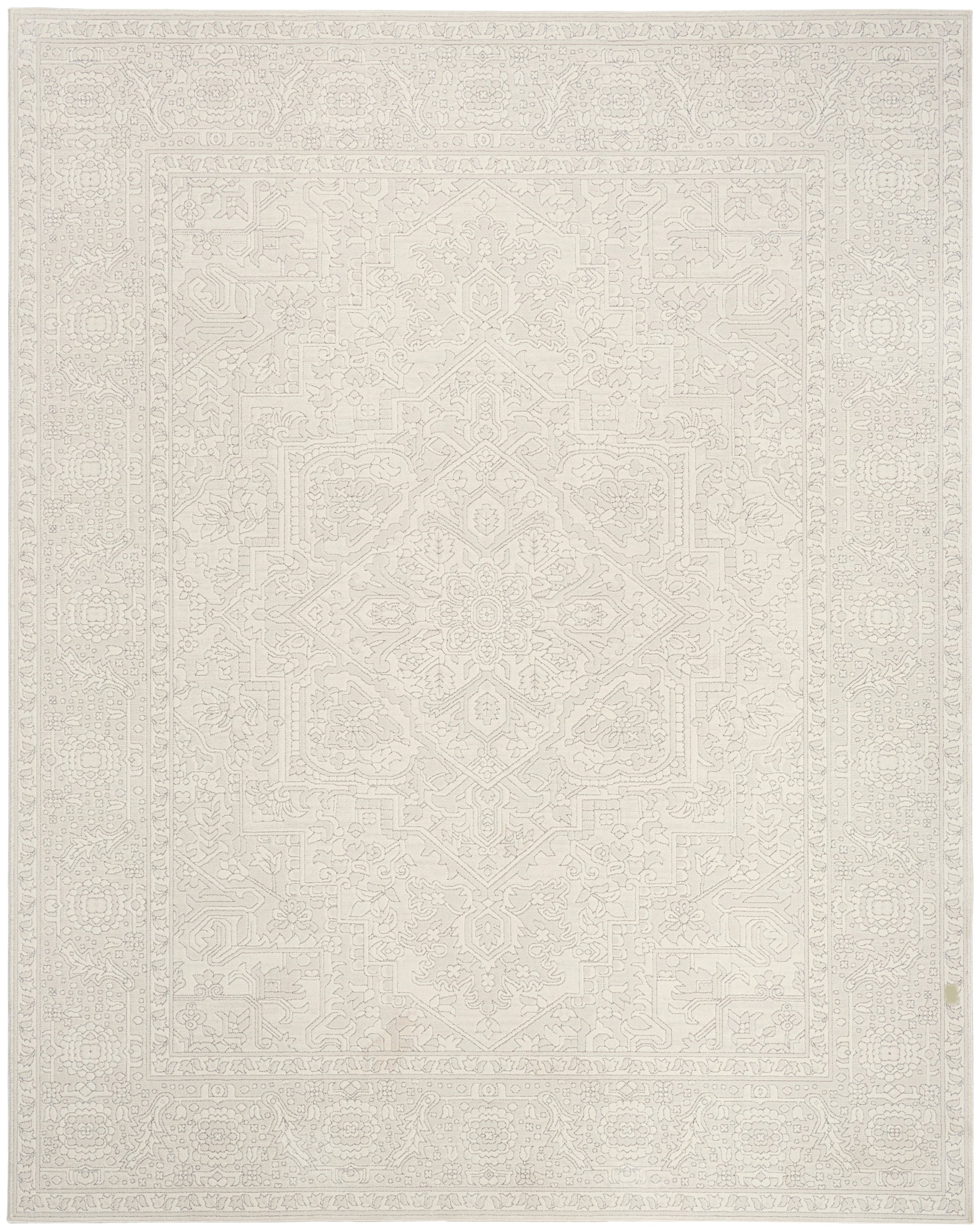 Cream-beige area rug with a subtle geometric medallion pattern and delicate border.
