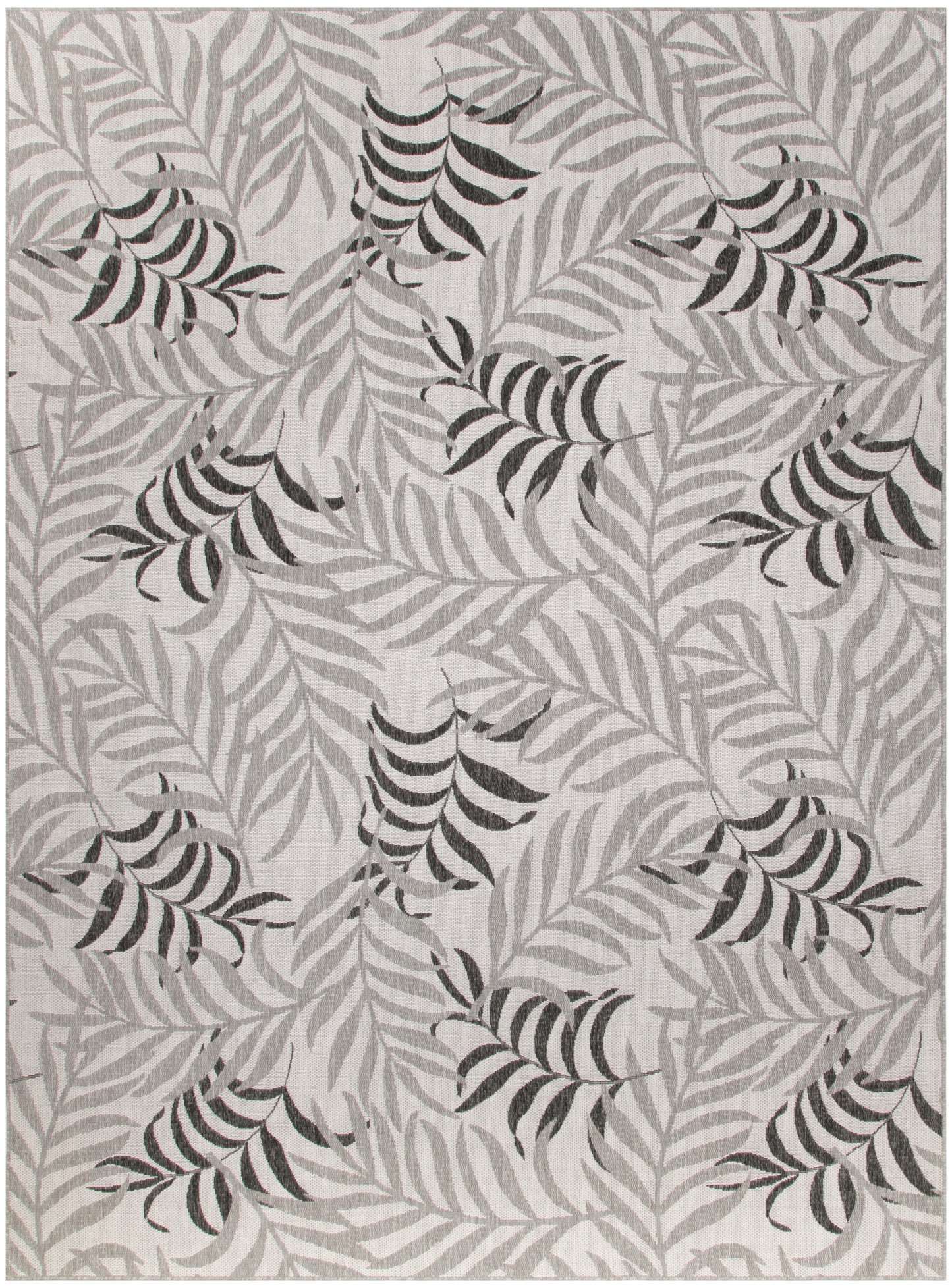 Rectangular gray rug with light leaf outlines and dark striped palm-frond clusters for a botanical, contemporary look.