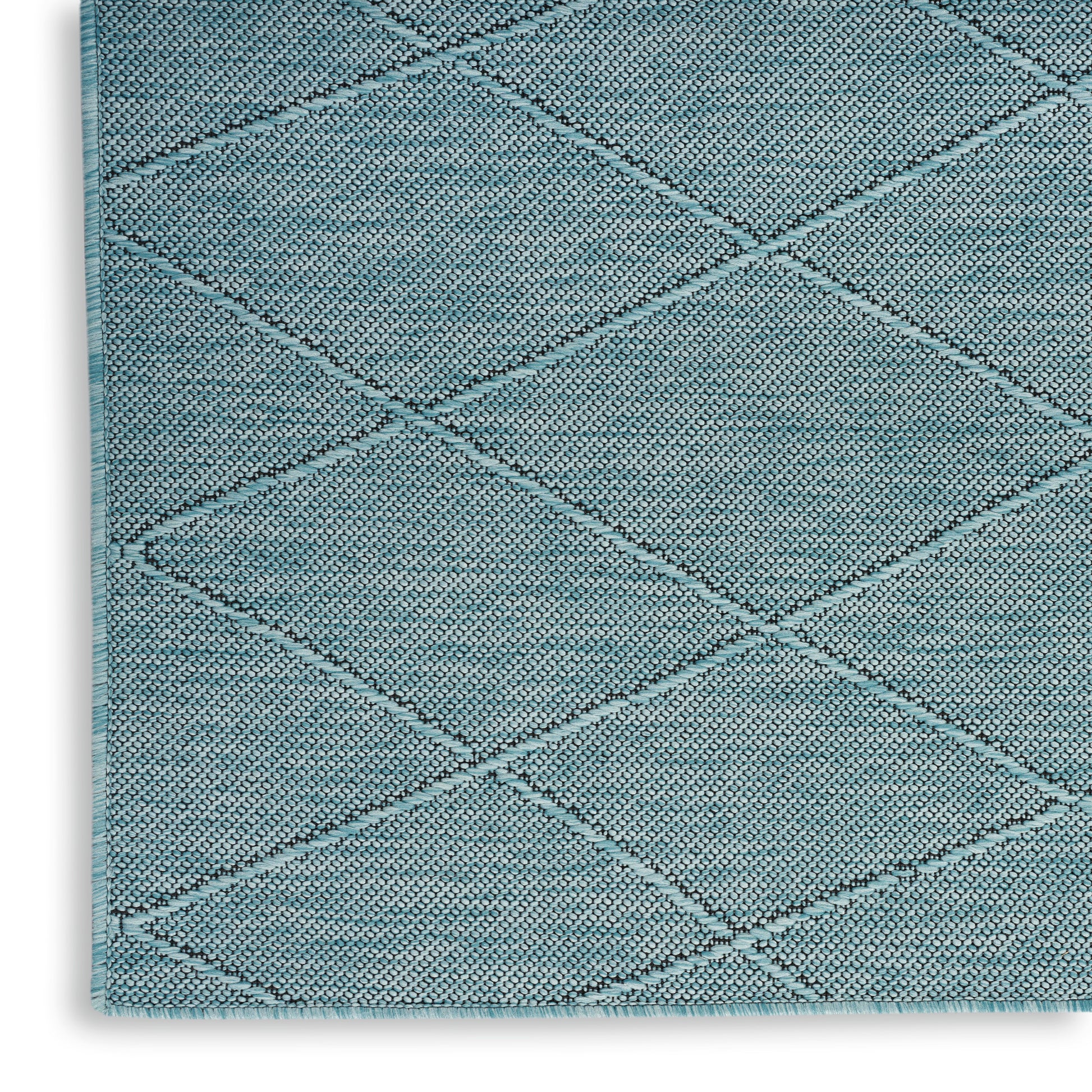 Teal diamond-quilted area rug with textured loop pile and bound edge; diagonal lattice pattern.