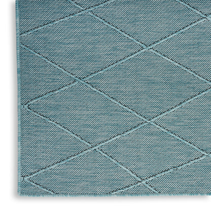 Teal diamond-quilted area rug with textured loop pile and bound edge; diagonal lattice pattern.