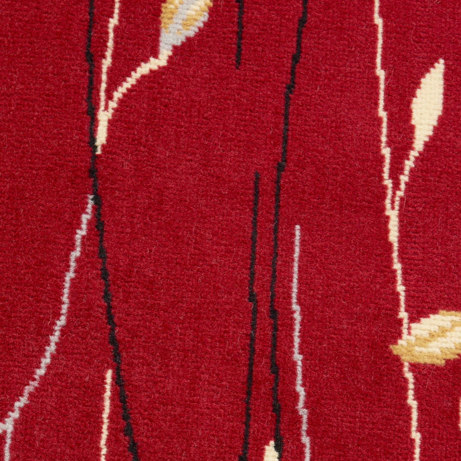 Red textured rug with vertical black stems and pale yellow leaf accents