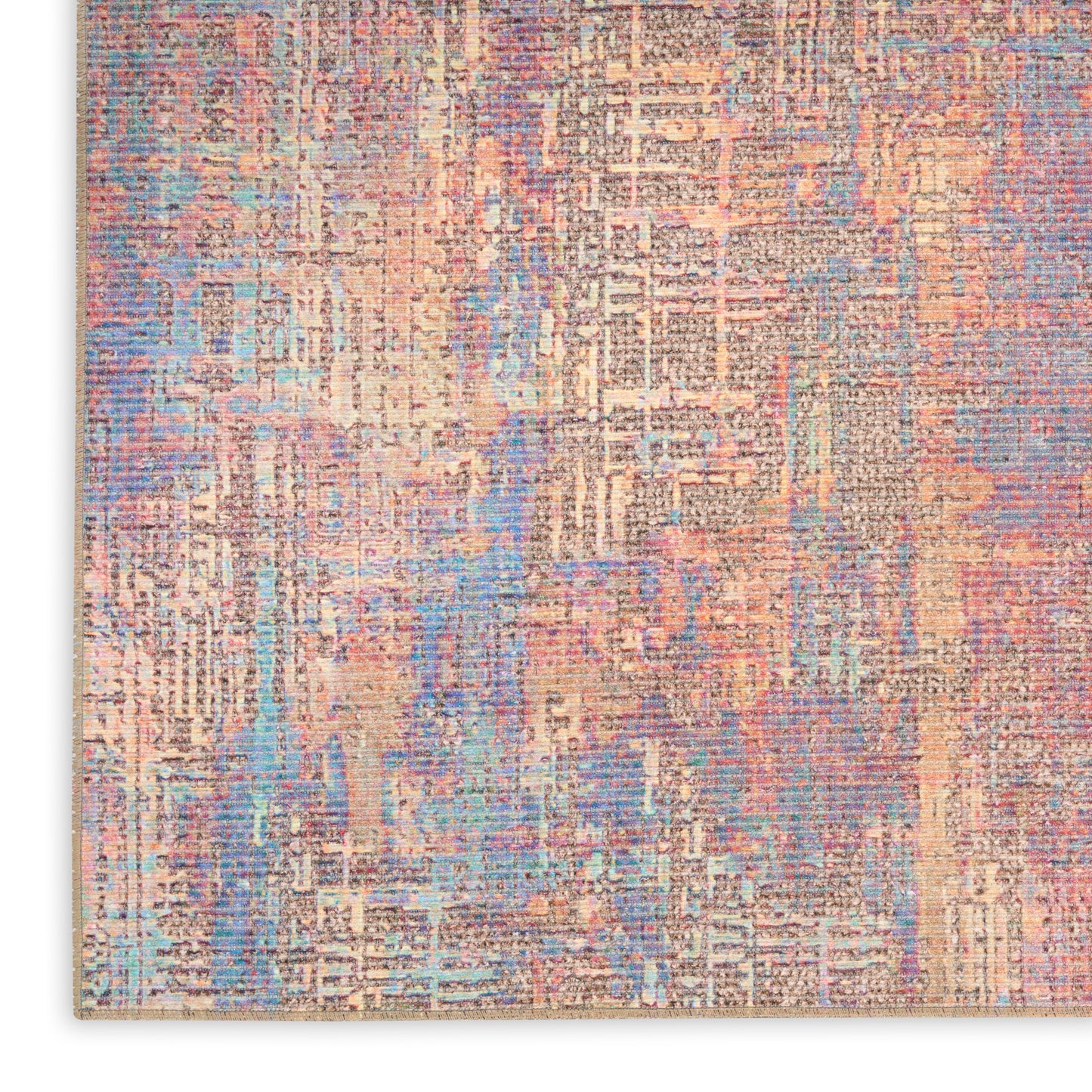 Abstract pastel area rug with peach, blue, lavender and cream tones in a distressed geometric pattern.