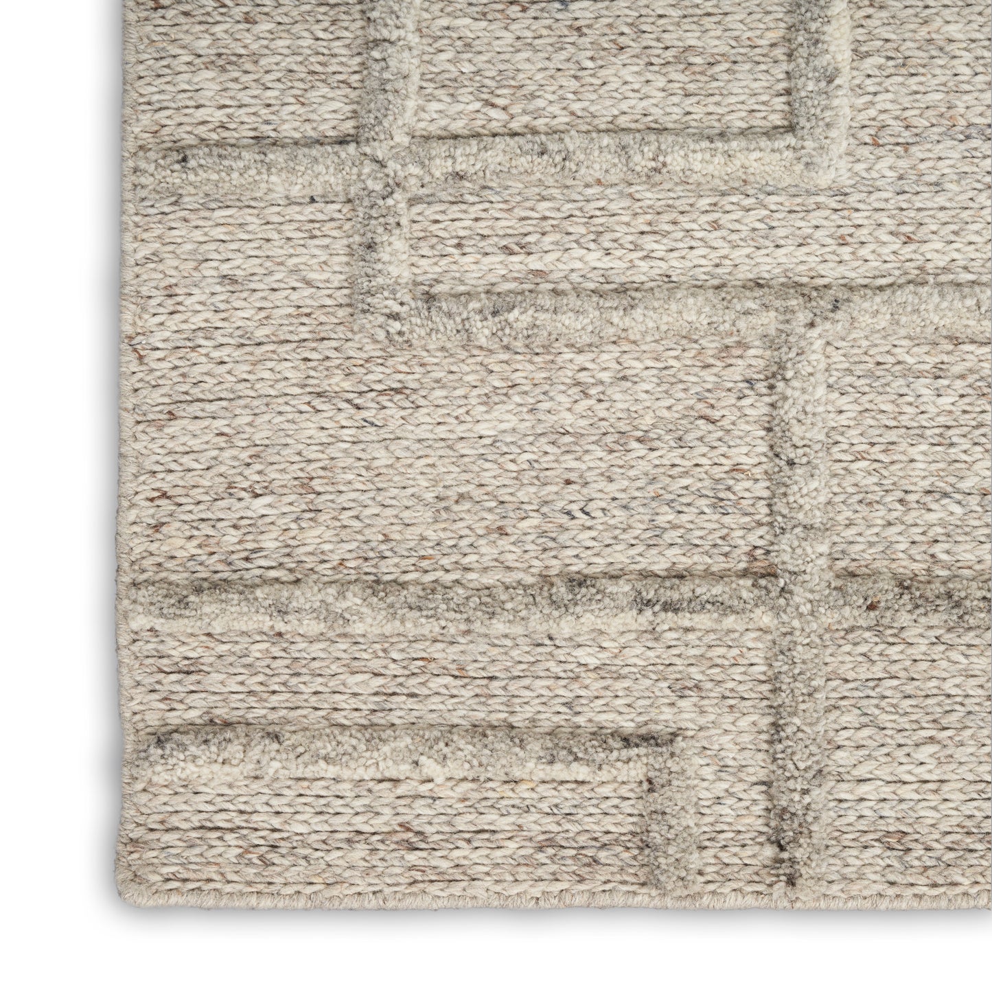 Beige woven rug with subtle taupe geometric rectangular pattern and textured braided surface.