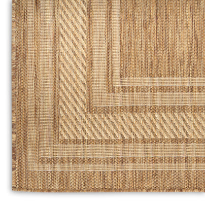 Beige woven area rug with concentric rectangular borders and braided texture