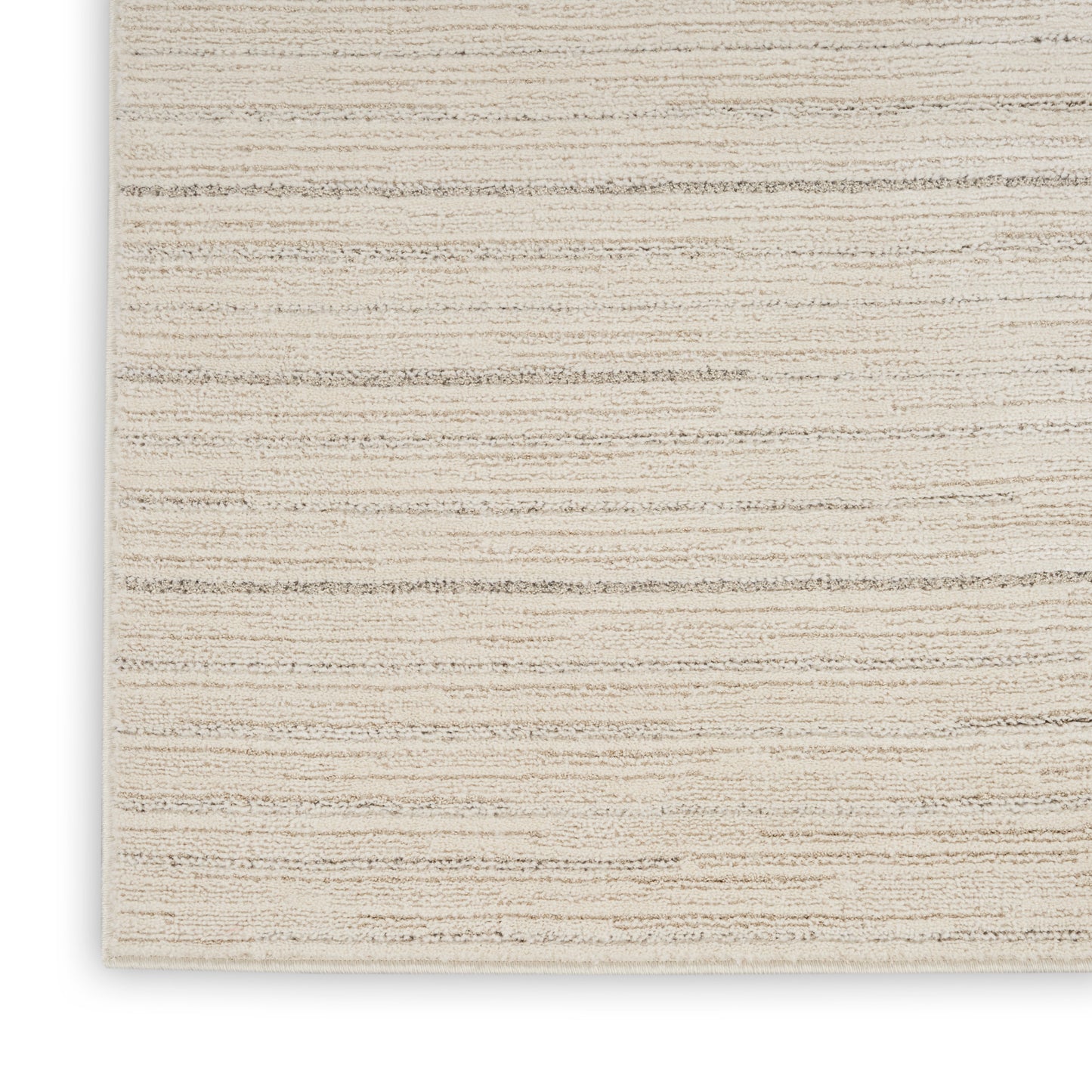 Beige flat-weave rug with subtle tan stripes; textured woven surface, rectangular, ideal for living room decor.