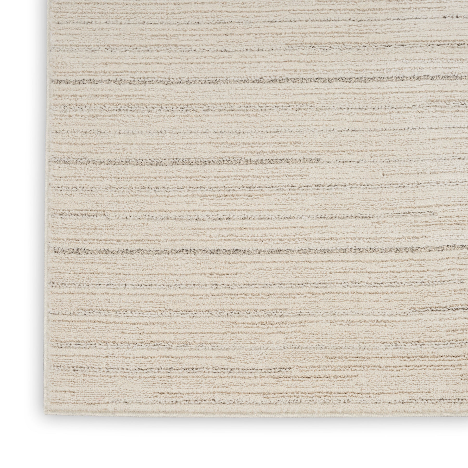 Beige flat-weave rug with subtle tan stripes; textured woven surface, rectangular, ideal for living room decor.