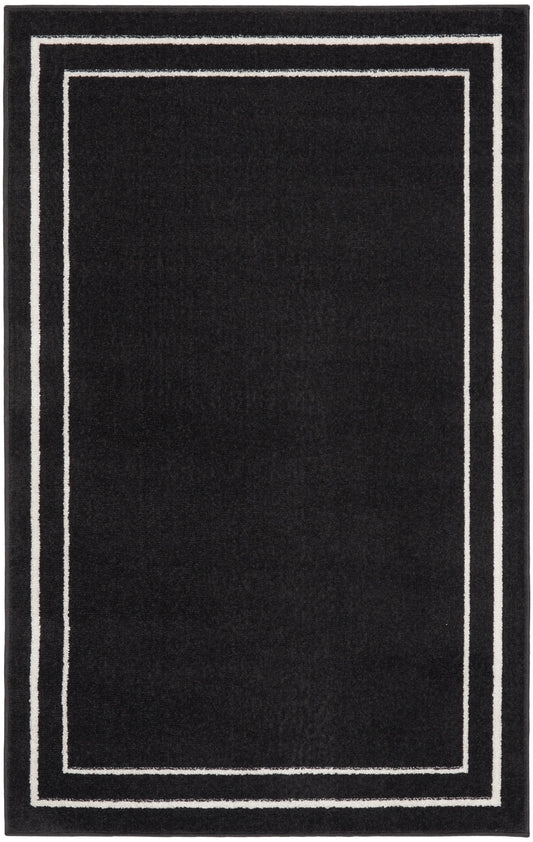 Black rectangular rug with double white borders forming a framed edge for a modern minimalist look.
