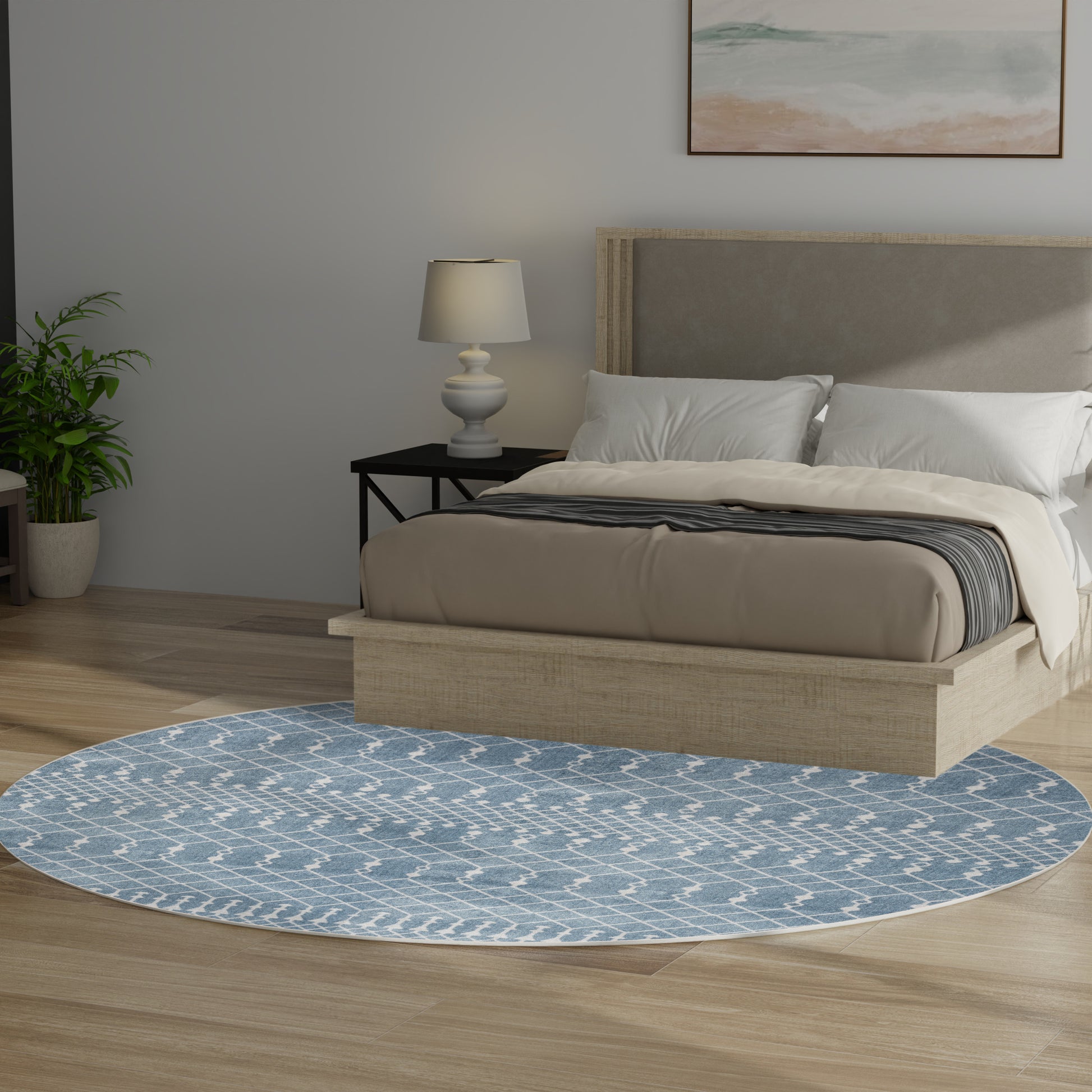 Round blue patterned area rug under beige platform bed with a gray upholstered headboard in a modern bedroom.
