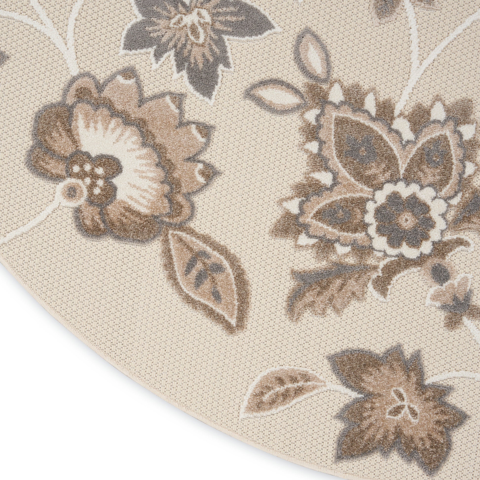 Beige round area rug with taupe-brown floral damask pattern and woven texture.