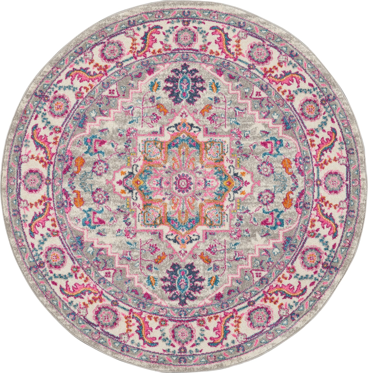 Round multicolor rug with ornate mandala medallion, pink, teal, orange and purple on a gray background.