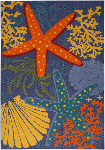 Outdoor coastal rug featuring orange and teal starfish, yellow coral and shells on a dark navy woven background.
